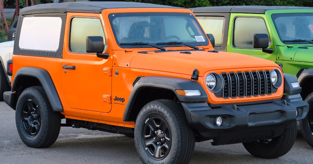 2025 Jeep Wrangler two-door Sport in bright orange