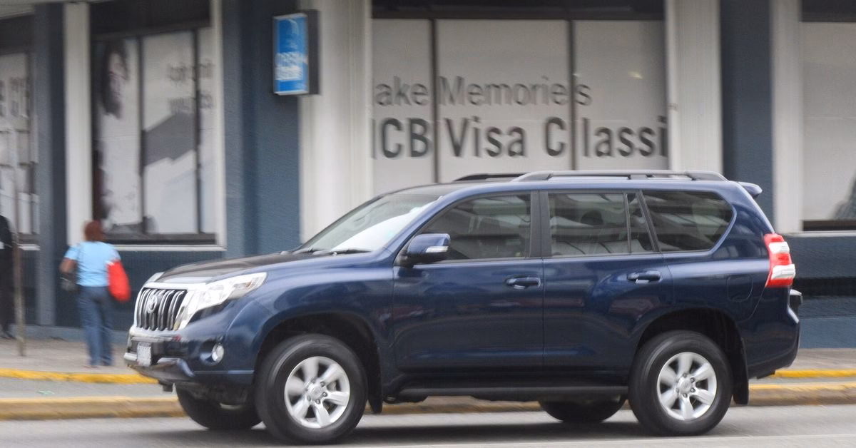 Dark blue Toyota Land Cruiser Prado 150 parked on a street